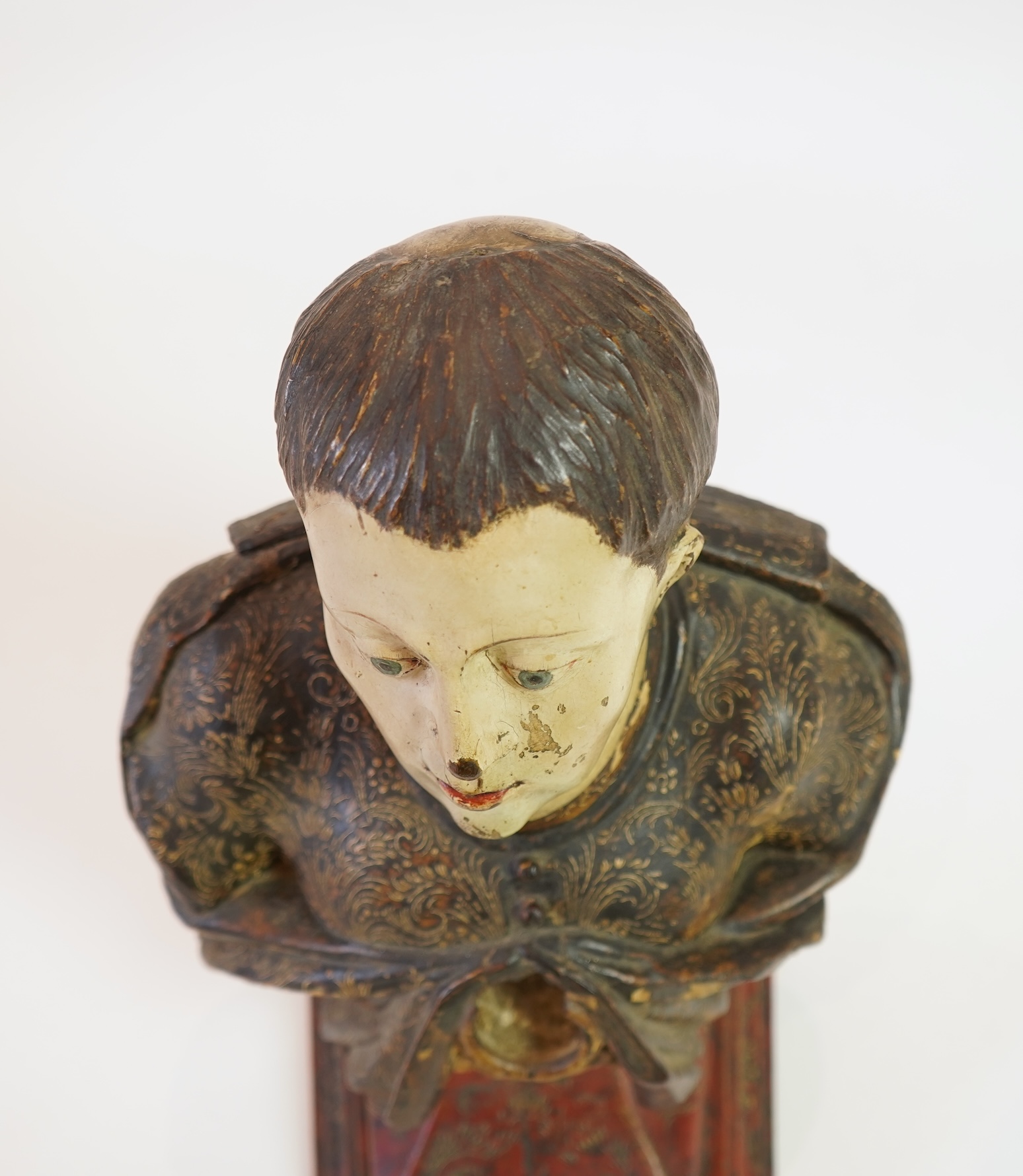 A 19th century Spanish polychrome wood bust of a Saint